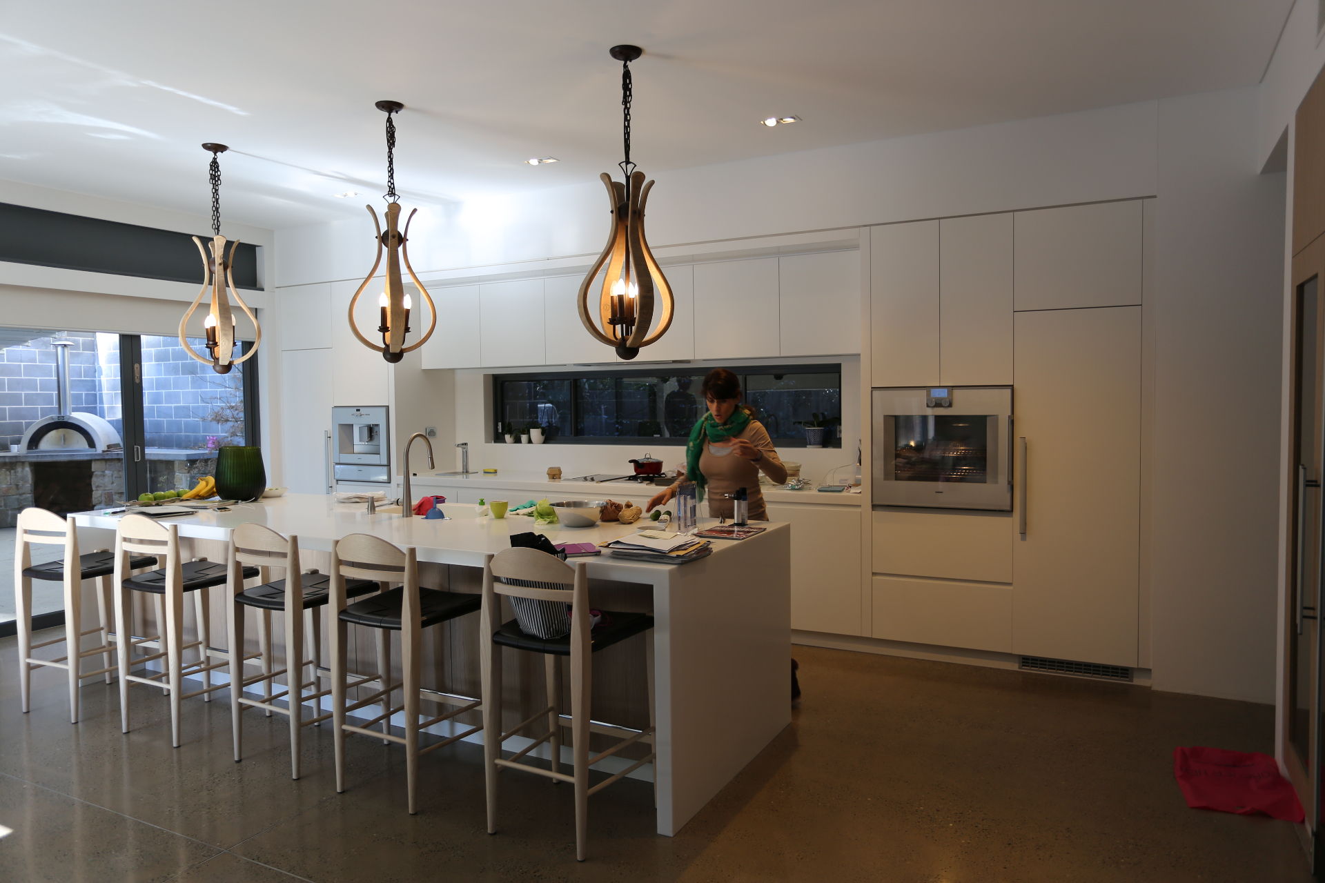 Contemporary white kitchen with island bench, pendant lighting and custom cabinetry by Mr Woodworx